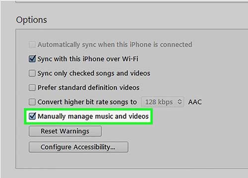 check the manually manage music and videos box